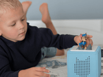 Child Playing With Chase Tonie Audio Figurine And Toniebox 2