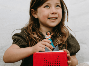 Child Playing With Disney Encanto Tonie