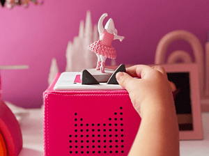 Child playing with Angelina Ballerina Tonie audio figurine and Toniebox 2