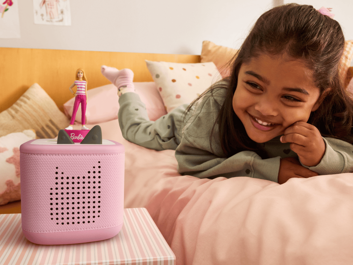 child playing in their bedroom with Barbie You Can Be Anything Tonie on a pink toniebox 2