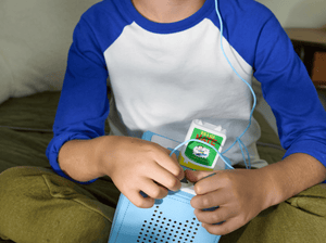 Child Playing With Big Nate Audio Figurine And Toniebox 2