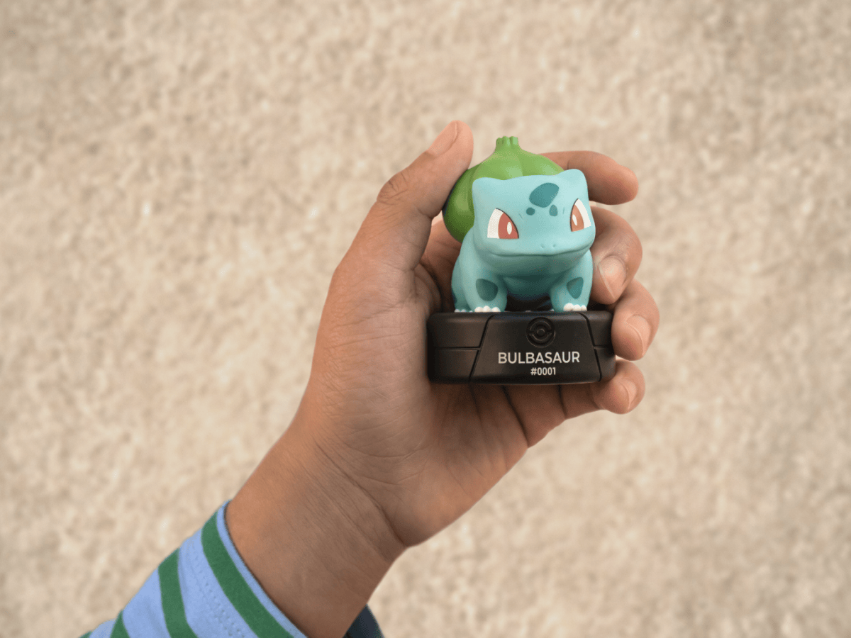 child holding the Pokémon Bulbasaur Tonie