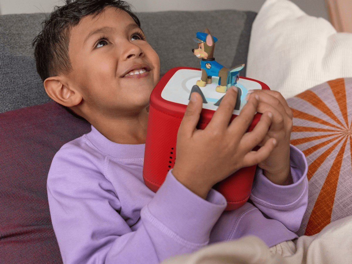 Child Playing With Red Toniebox 2, An Audio Player For Kids With Chase Audio Figurine
