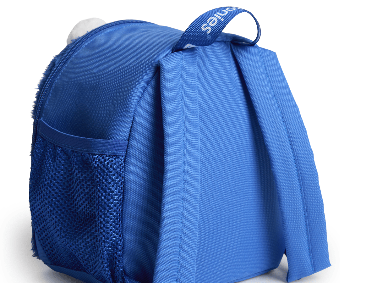 back tilted view of Toniebox Sesame Street Cookie Monster Backpack used to carry Toniebox, Tonies and accessories