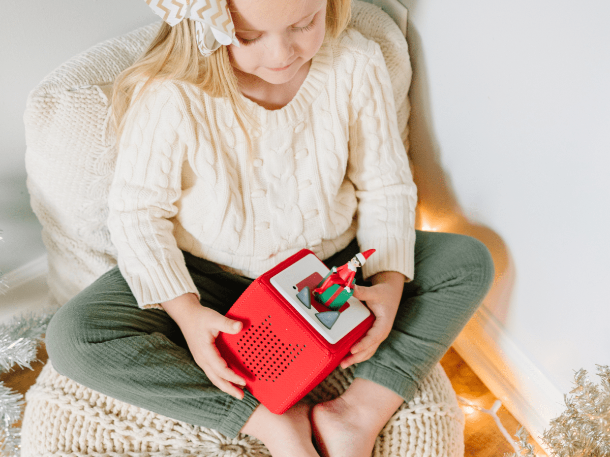 Child Playing With The Elf On The Shelf Tonie