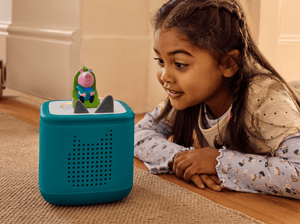 child playing with Peppa Pig- George’s New Sounds Tonie and a teal toniebox 2