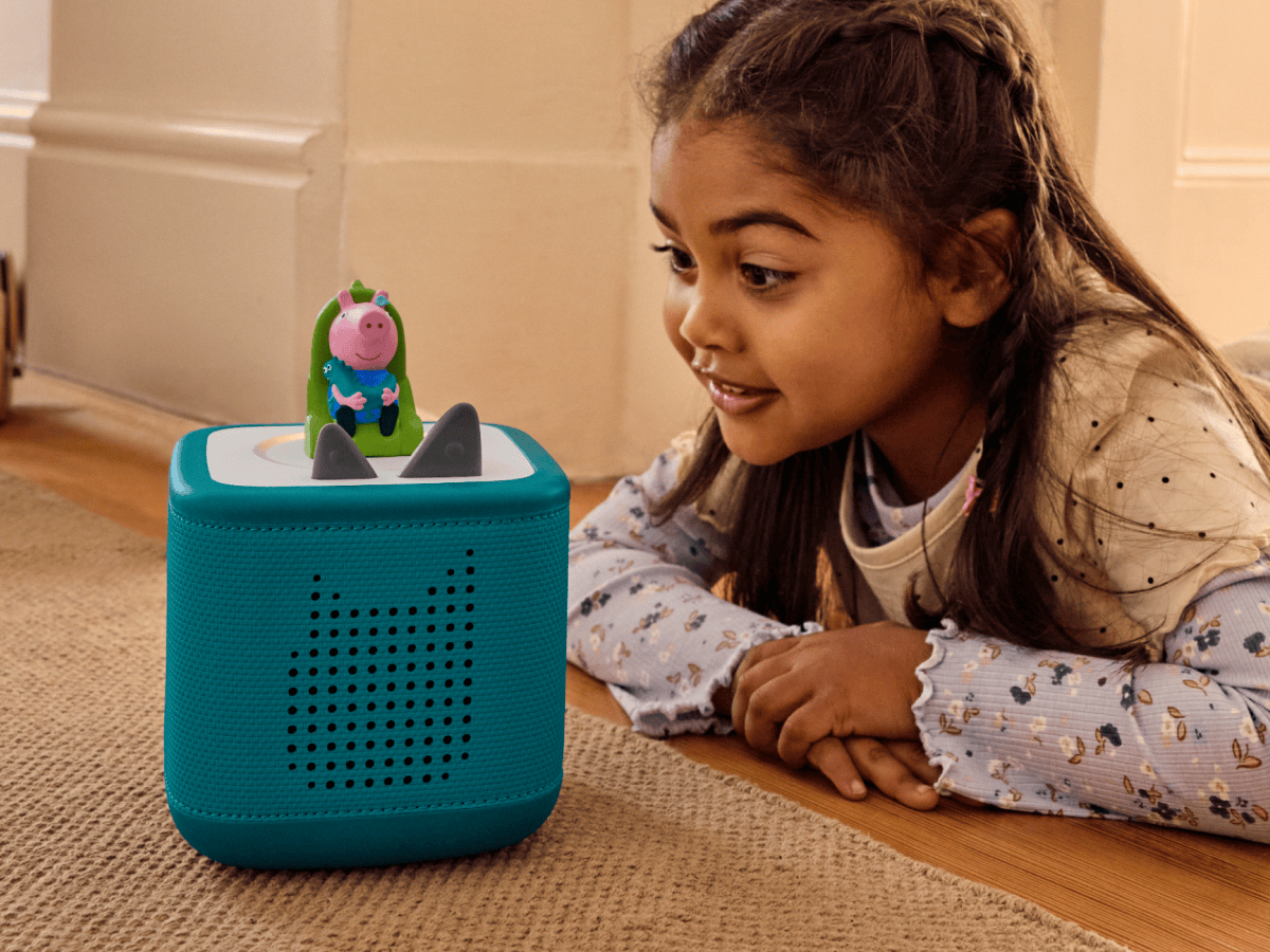 child playing with Peppa Pig- George’s New Sounds Tonie and a teal toniebox 2
