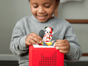 Child Playing With Disney Holiday Mickey Tonie