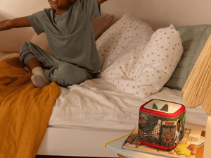 Child Playing Near A Jurassic Park Sleeve On A Red Toniebox 2