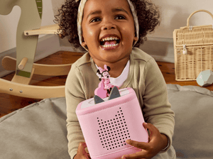 Child playing with a pink toniebox 2 and Disney Minnie Mouse Clubhouse Tonie