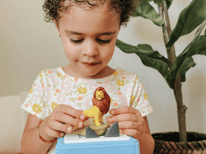 Child Playing With Disney The Lion King Tonie