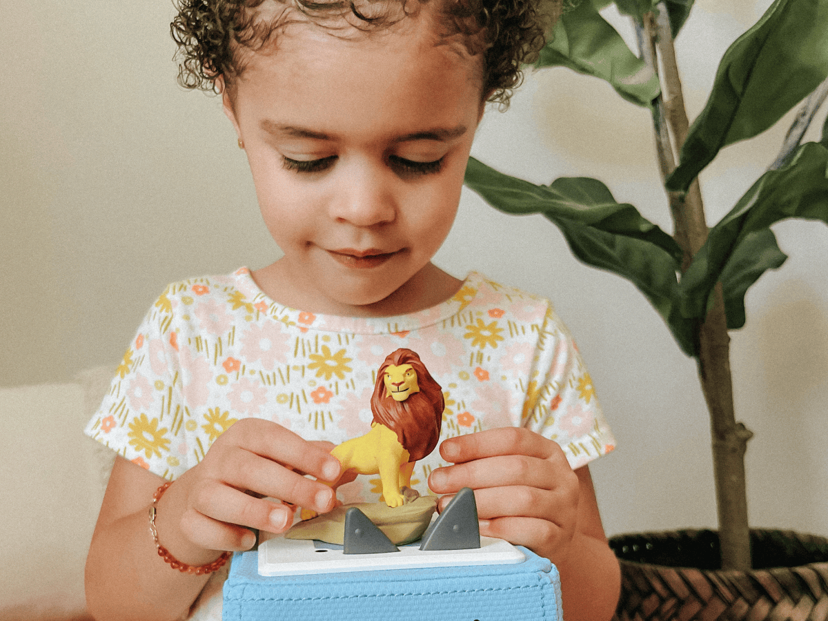 Child Playing With Disney The Lion King Tonie