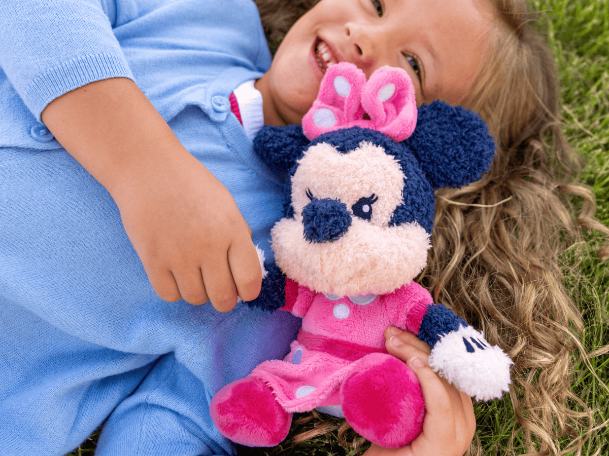 Child playing with Cuddle Tonie Disney Minnie audio figurine and Toniebox 2