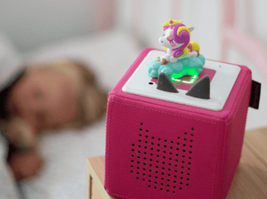 Child Playing With Moshi- Fluttercup Tonie Audio Figurine And Toniebox 2