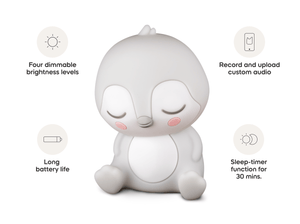 Child playing with Sleepy Friends Sleepy Penguin Night Light audio figurine and Toniebox 2