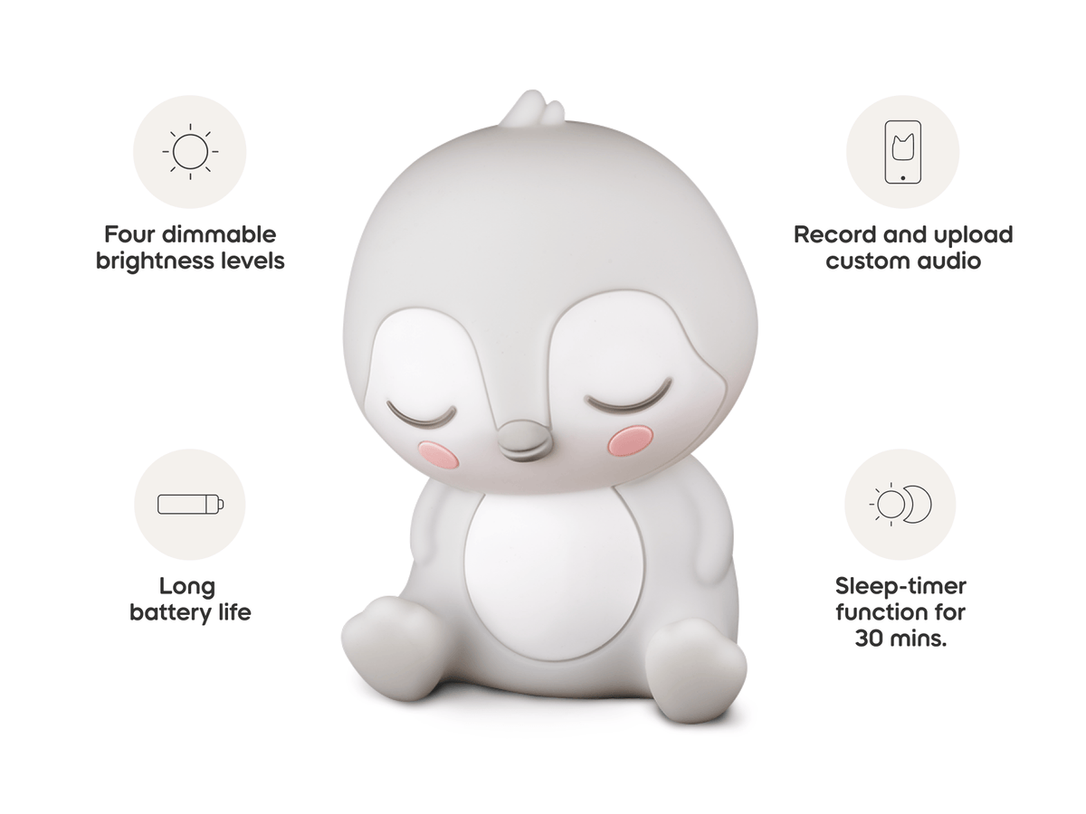 Child playing with Sleepy Friends Sleepy Penguin Night Light audio figurine and Toniebox 2