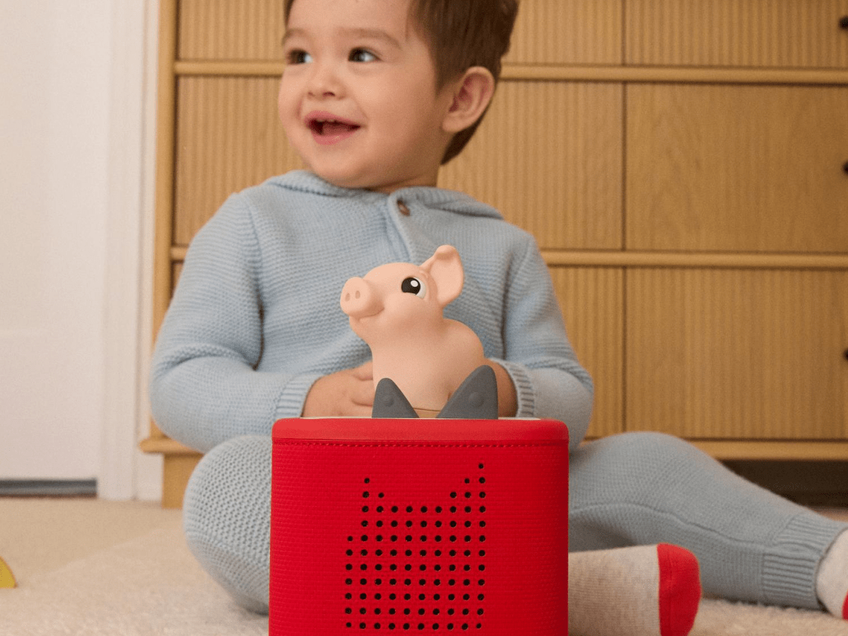 Child playing with My First Tonies Pig audio figurine and Toniebox 2