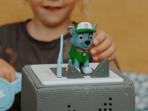 Child Playing With Rocky Tonie Audio Figurine And Toniebox 2