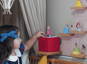 Child Playing With Disney Sleeping Beauty Tonie