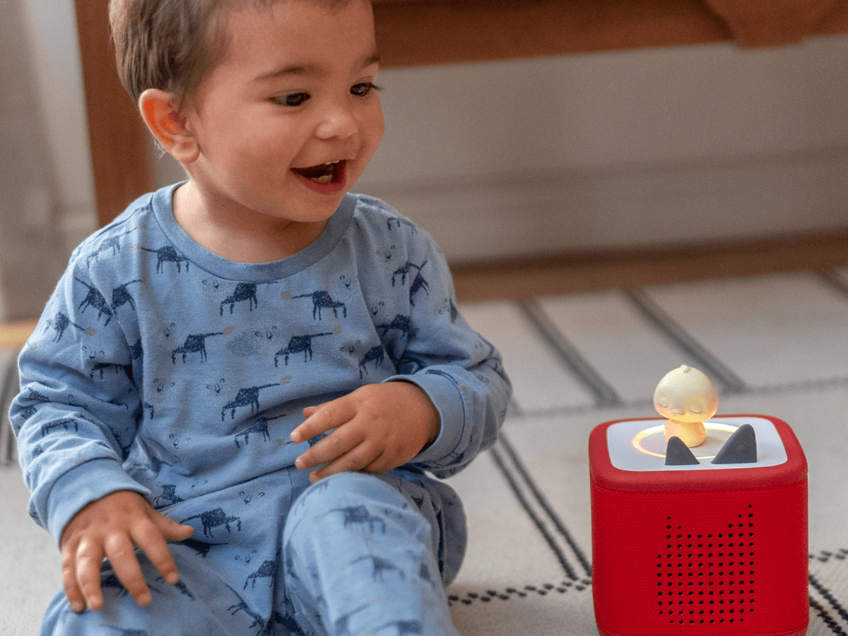 Child Playing With Sleepy Duck Audio Figurine And Toniebox 2