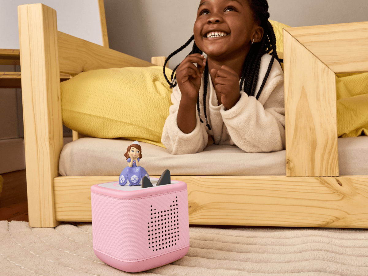 child playing with a pink toniebox 2 and Disney Sofia the First Tonie