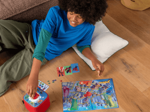 child playing with Tonieplay Marvel Spider-Man Neighborhood on a red toniebox 2