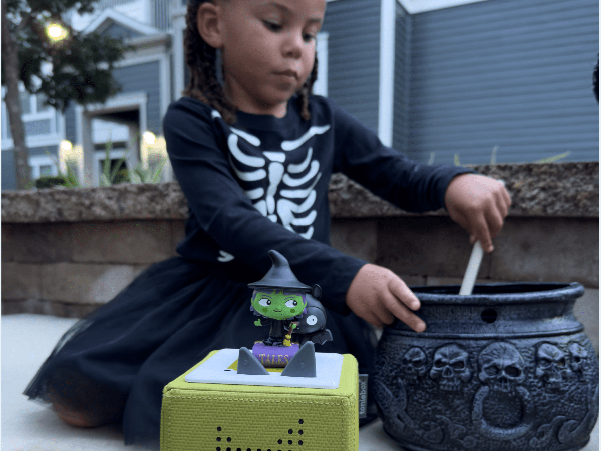 Child Playing With Favorite Tales: Spooky Tales Tonie