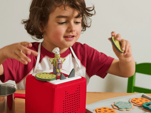 Child Playing With Tiny Chef Tonie