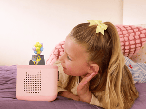 Child playing with Disney and Pixar Up Tonie audio figurine and Toniebox 2