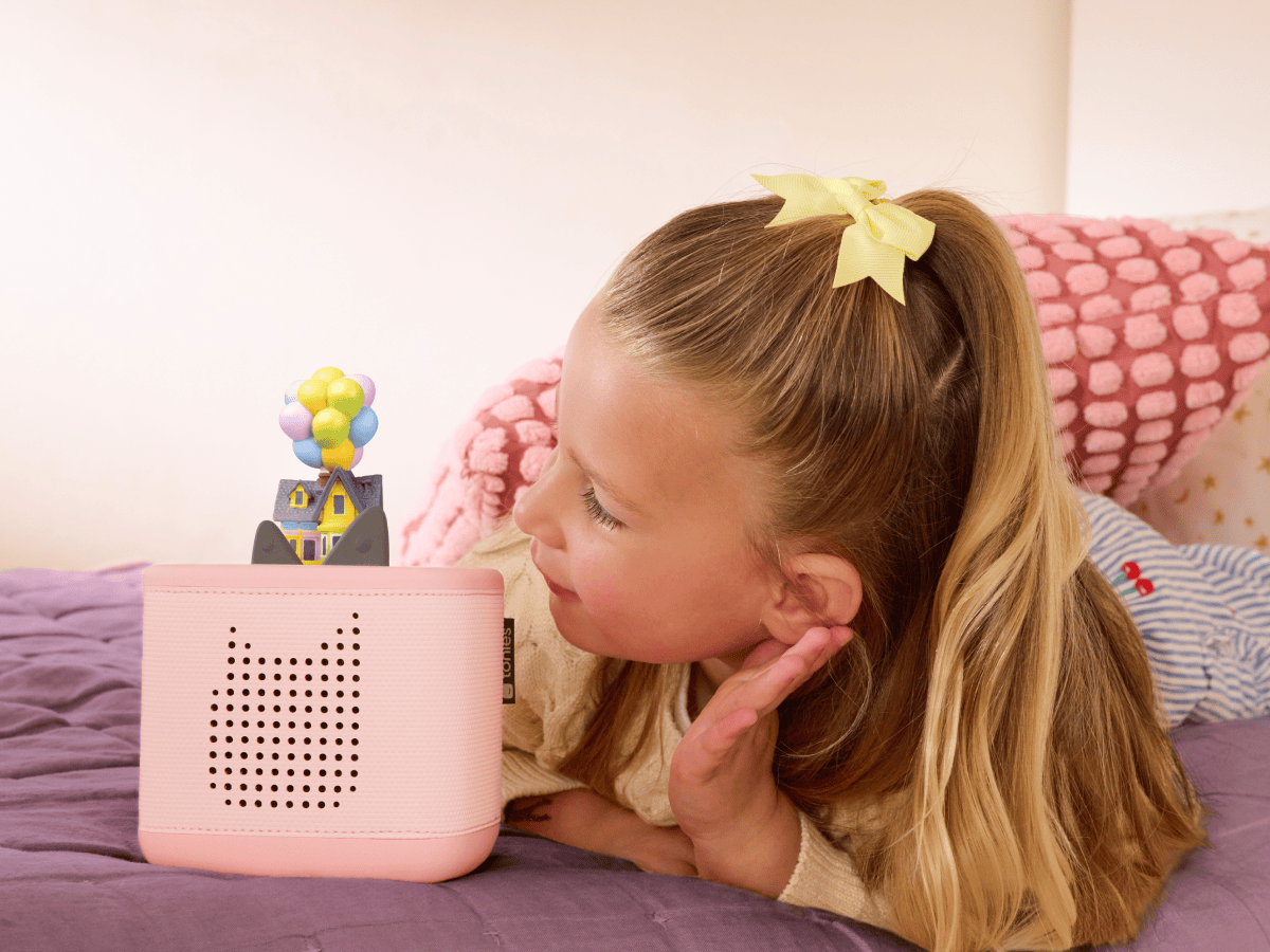 Child playing with Disney and Pixar Up Tonie audio figurine and Toniebox 2
