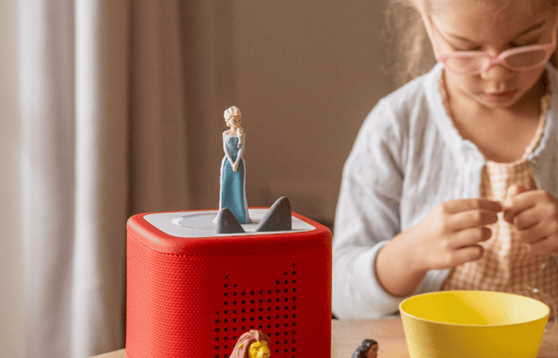 Disney Tonies with a red Toniebox 2 on a table while a child has craft time