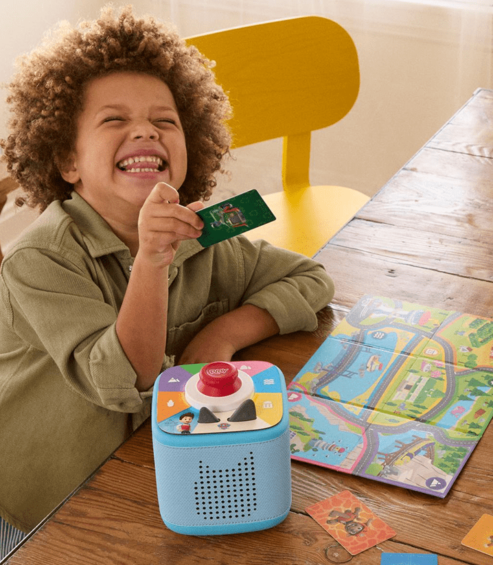 child playing PAW Patrol Tonieplay game on a blue Toniebox 2
