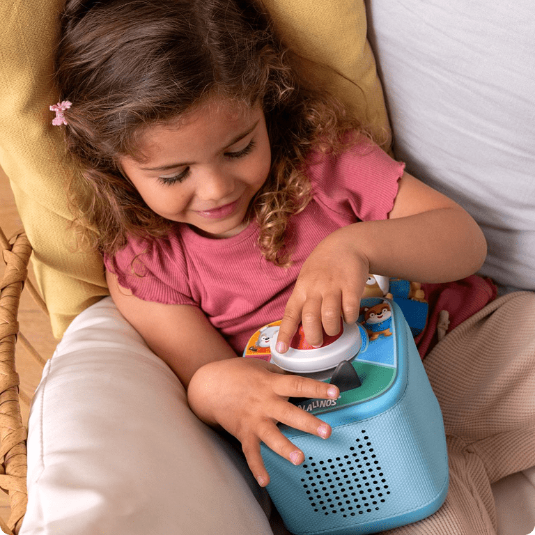 Child playing Tonieplay game on a blue Toniebox 2