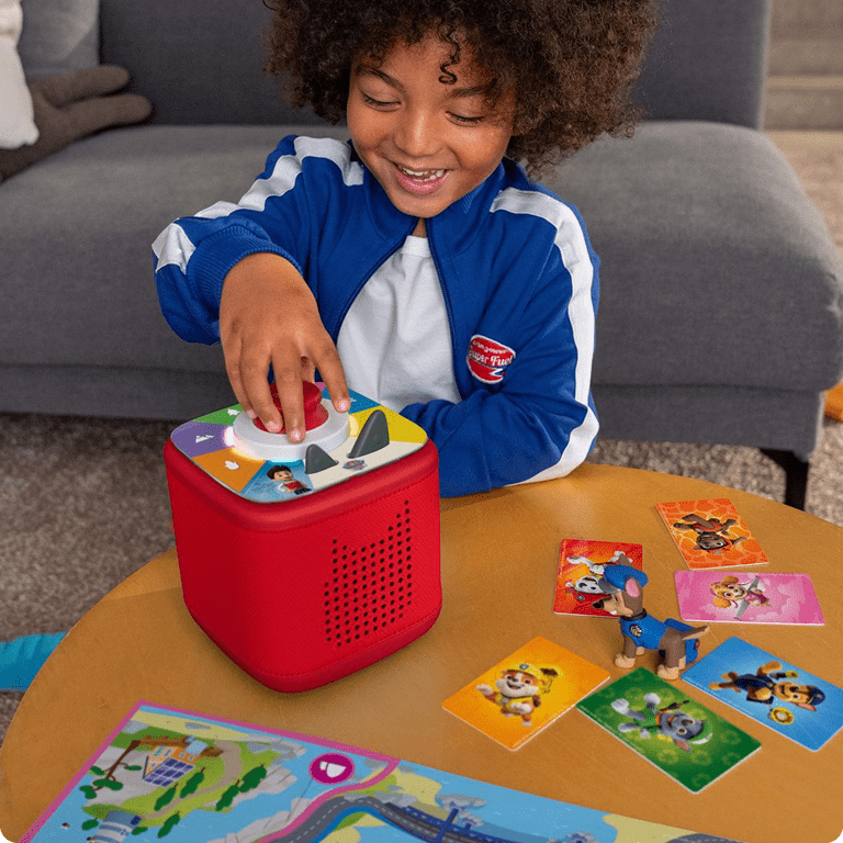 child playing PAW Patrol Tonieplay game with a red Toniebox 2 