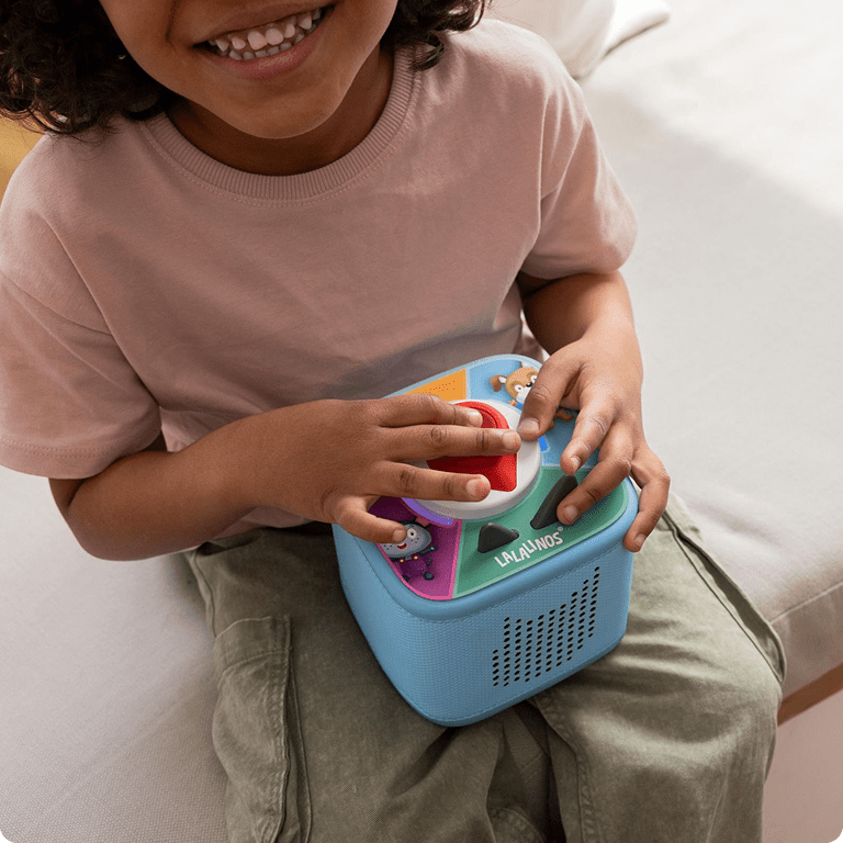 blue Toniebox 2 with a Tonieplay game on top resting in a child's lap