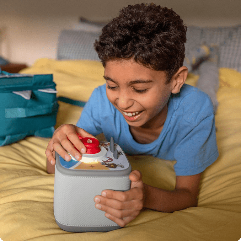 older boy playing a Tonieplay game on a grey Toniebox 2